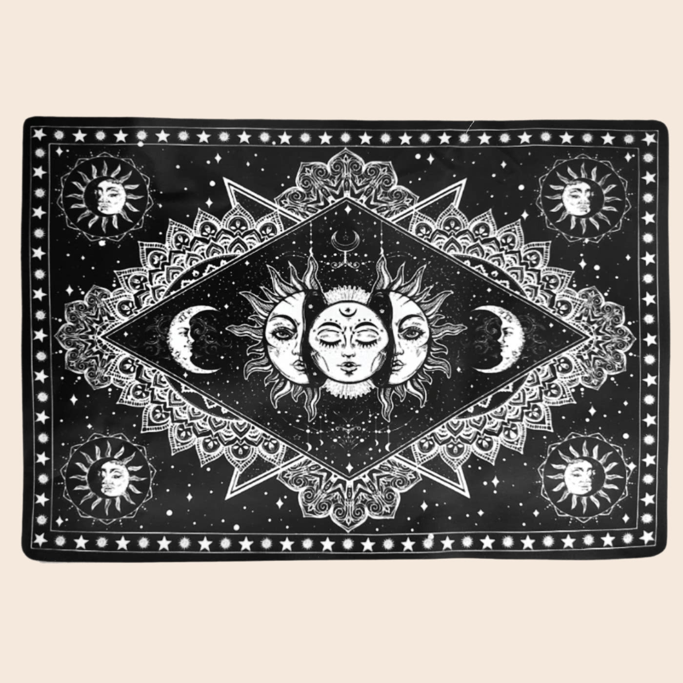 Decorative mat with celestial design featuring suns, moons, and stars on a black background.