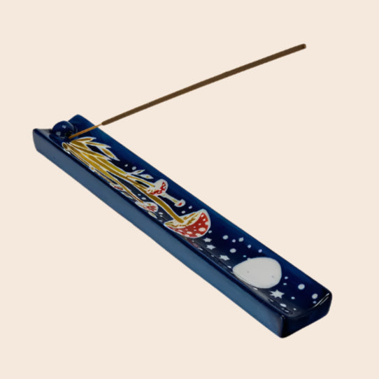 Incense holder with a decorative design on a white background