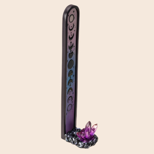 Decorative incense stick holder with purple crystal on a white background
