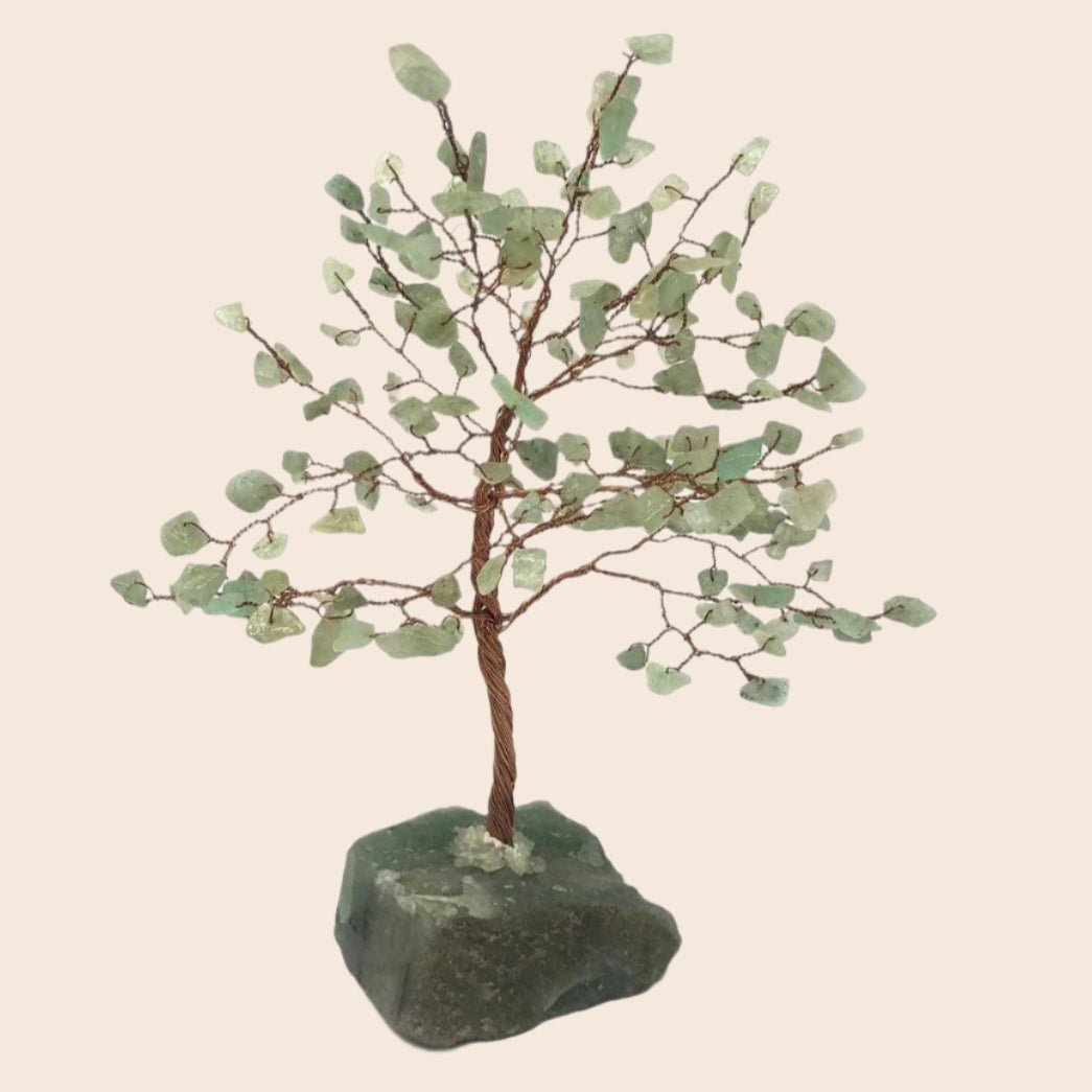 Decorative tree made of green stones on a white background