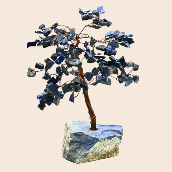 Decorative tree made of blue stones on a white background
