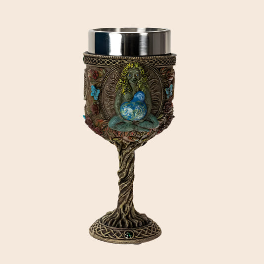 Decorative goblet with a woman and butterfly design on a white background