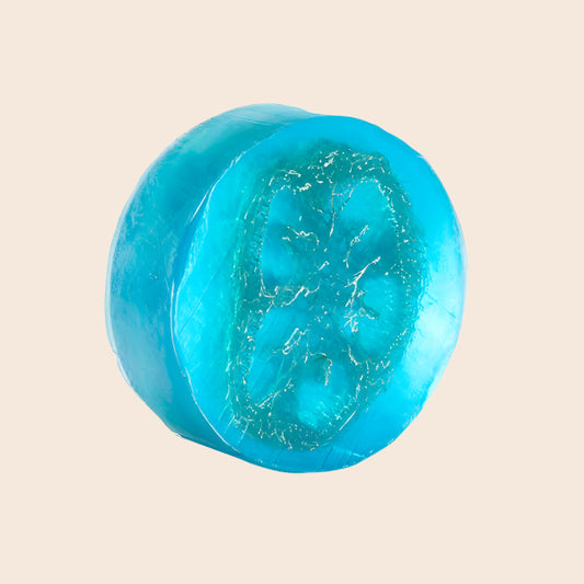 Turquoise-colored soap bar on a white background