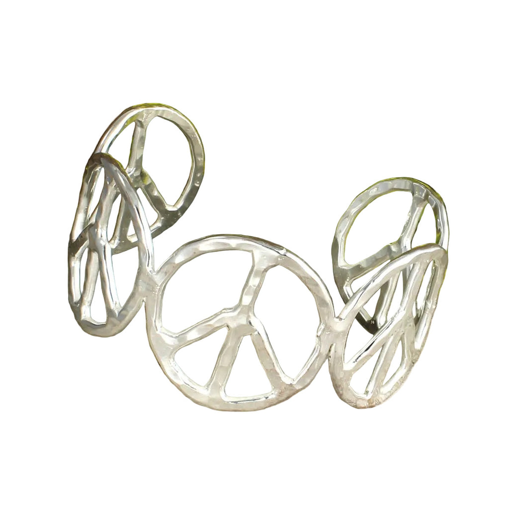 Silver peace symbol bracelet on a white background