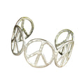 Silver peace symbol bracelet on a white background