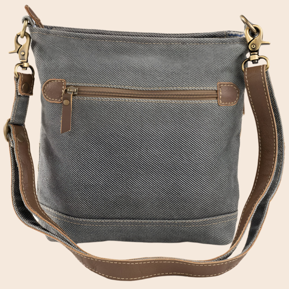 Gray shoulder bag with brown leather accents on a white background