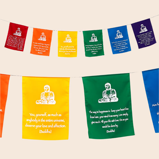 Colorful prayer flags with Buddha illustrations and quotes on a white background