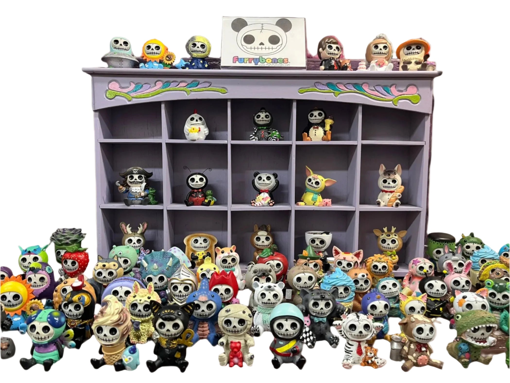 A collection of Furrybones figurines dressed in various costumes, displayed in multiple rows with a shelf in the background.