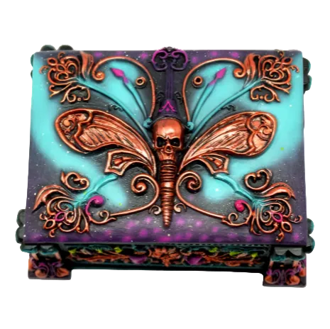 A hand-painted decorative box featuring a death moth design with predominantly purple and turquoise colors.