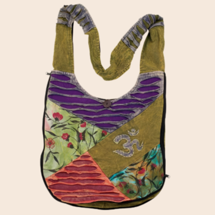 Colorful handbag with floral patterns and a symbol on a beige background