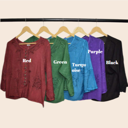 Five shirts in red, green, turquoise, purple, and black on hangers with color labels.