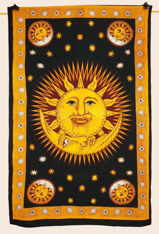Decorative tapestry with sun and moon design on a black background