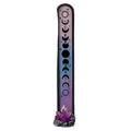 Decorative incense stick holder with moon phases design on a white background