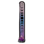 Decorative incense stick holder with moon phases design on a white background