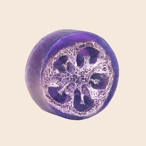 Purple soap bar with a decorative design on a white background