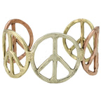 A cuff-style ring featuring three interlocking peace sign motifs in different metals: a large textured gold-tone center sign, a smaller gold-tone right sign, and a rose gold-tone left sign, shown on a plain white background.