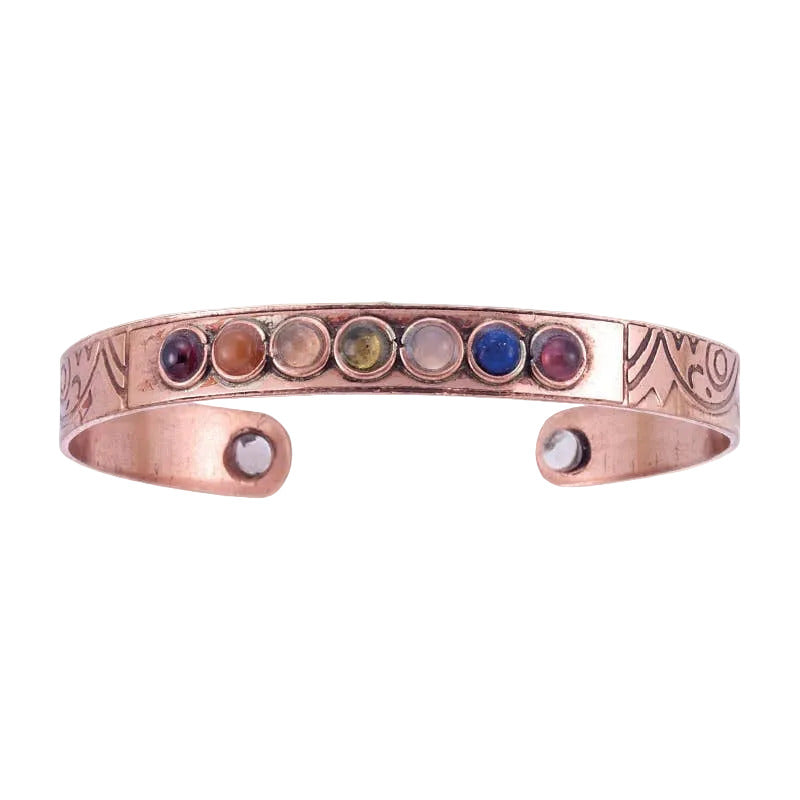 Copper bracelet with embedded gemstones on a white background